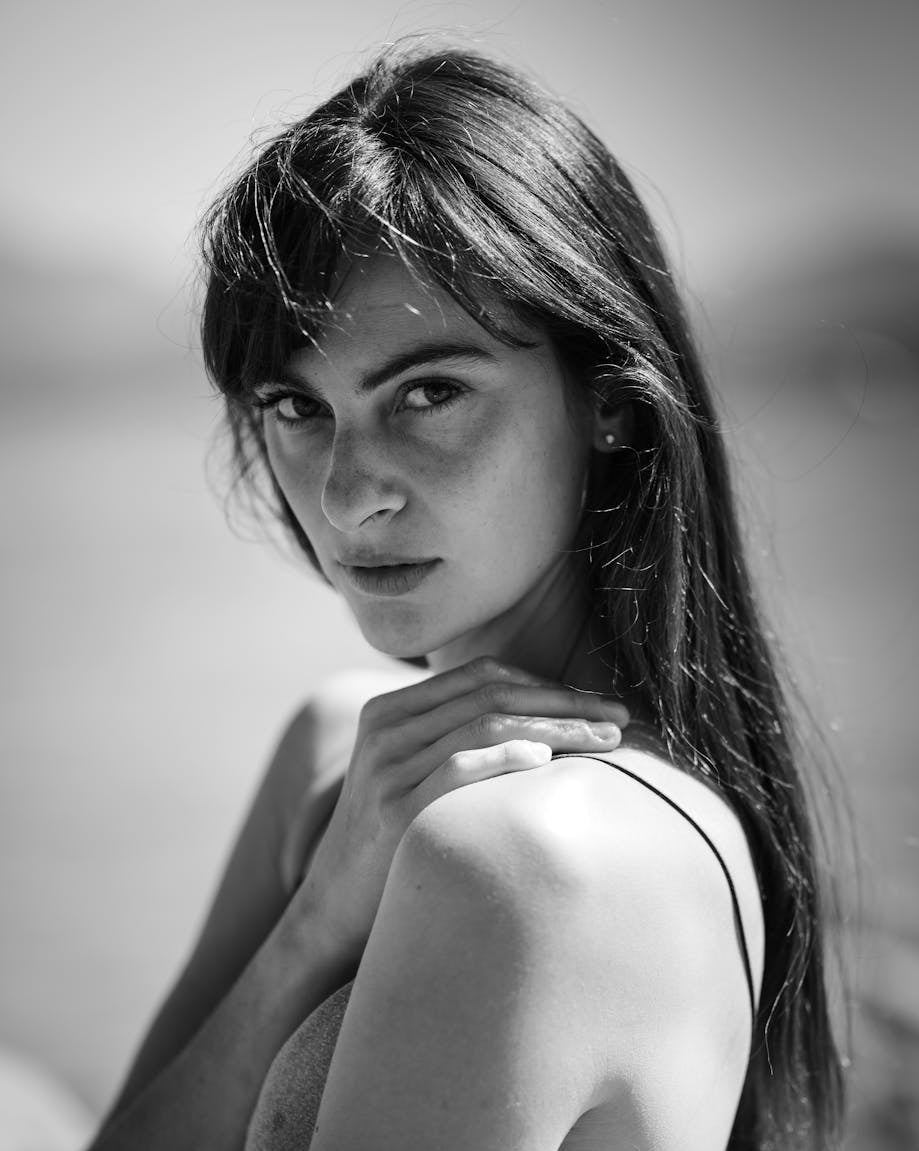 Black and white portrait of a woman with a blurred background