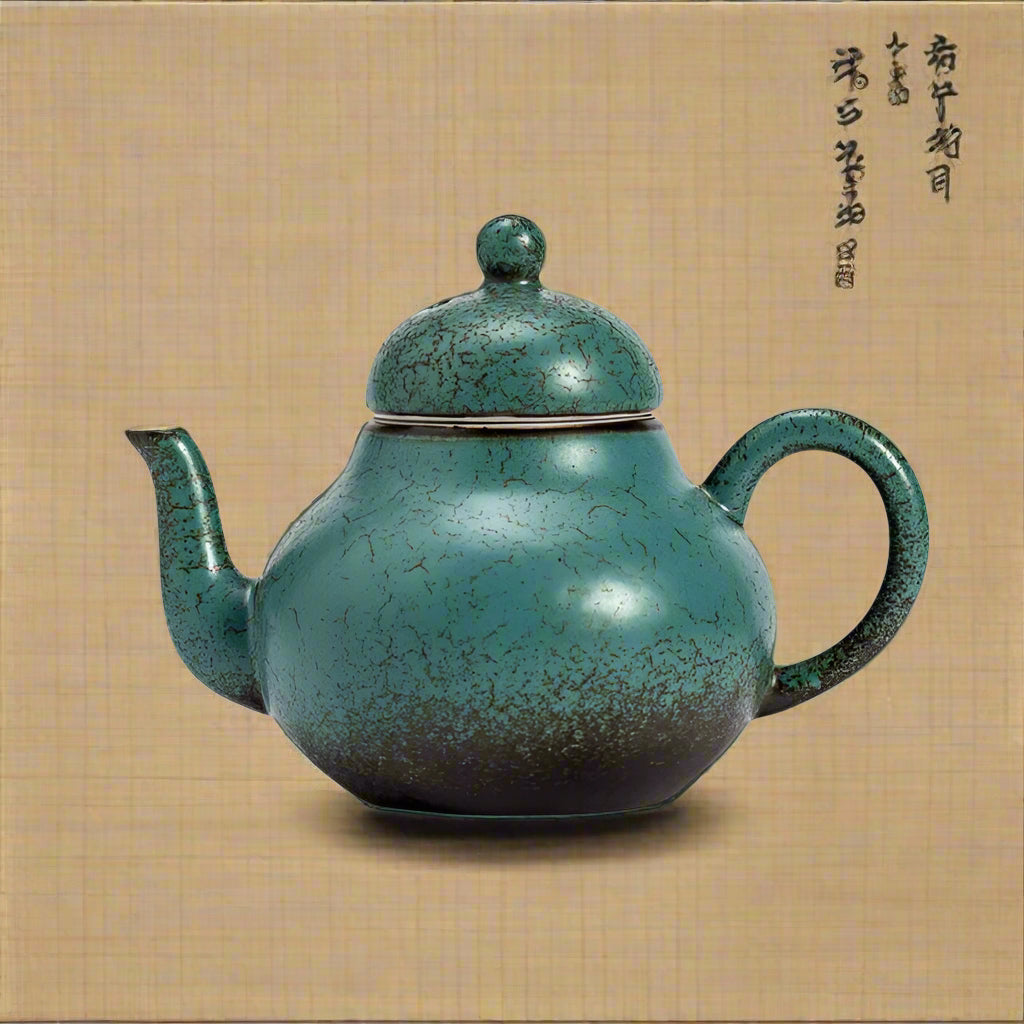 Teal ceramic teapot on a light gray background