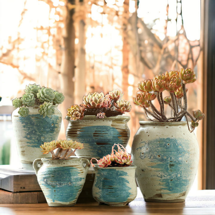 Handmade rustic blue-painted flowerpot