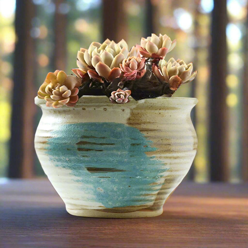 Handmade rustic blue-painted flowerpot