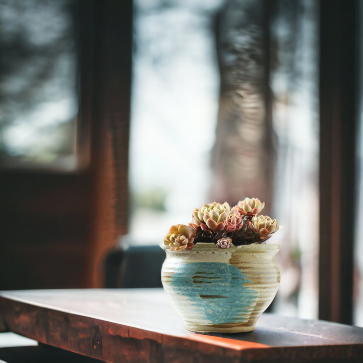Handmade rustic blue-painted flowerpot