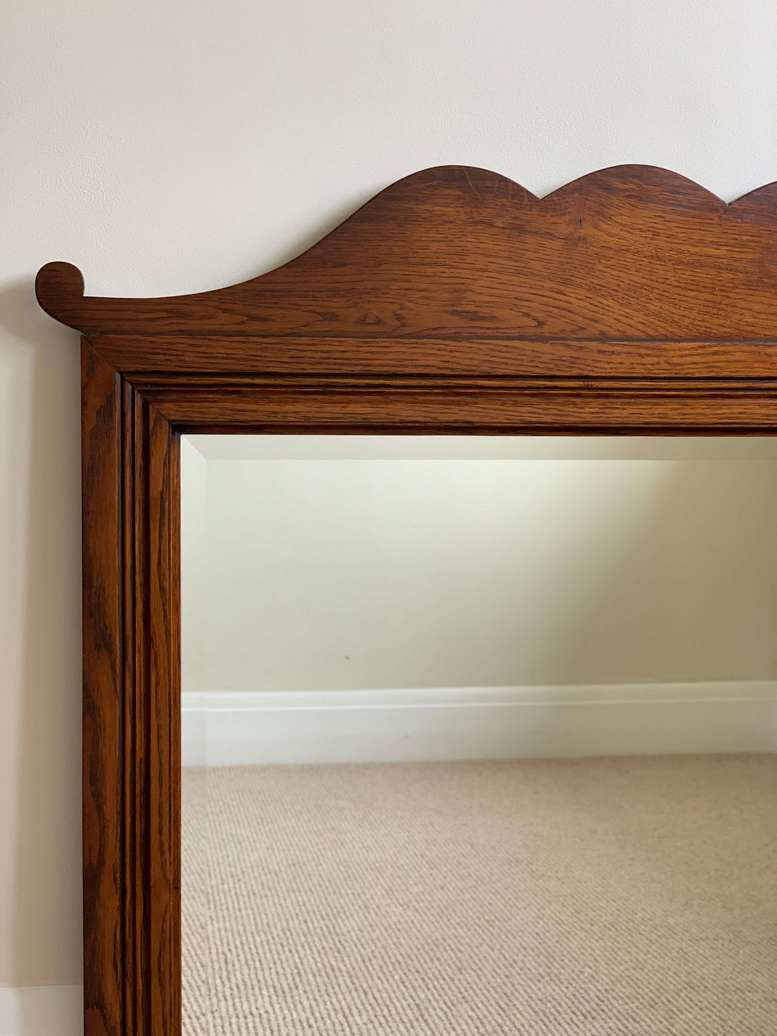 Antique oak-framed bevelled mirror