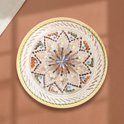 Cara Serving Plate on a warm terracotta background