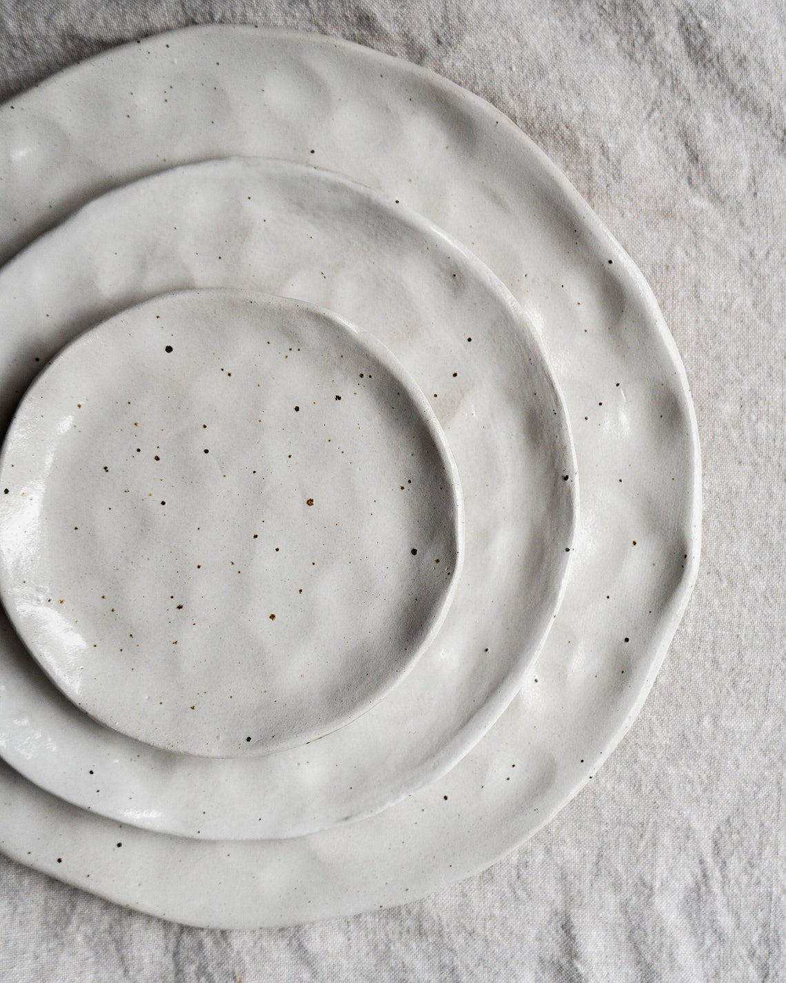 White flecked handmade ceramic plates