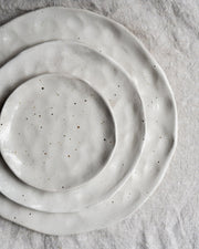 White flecked handmade ceramic plates