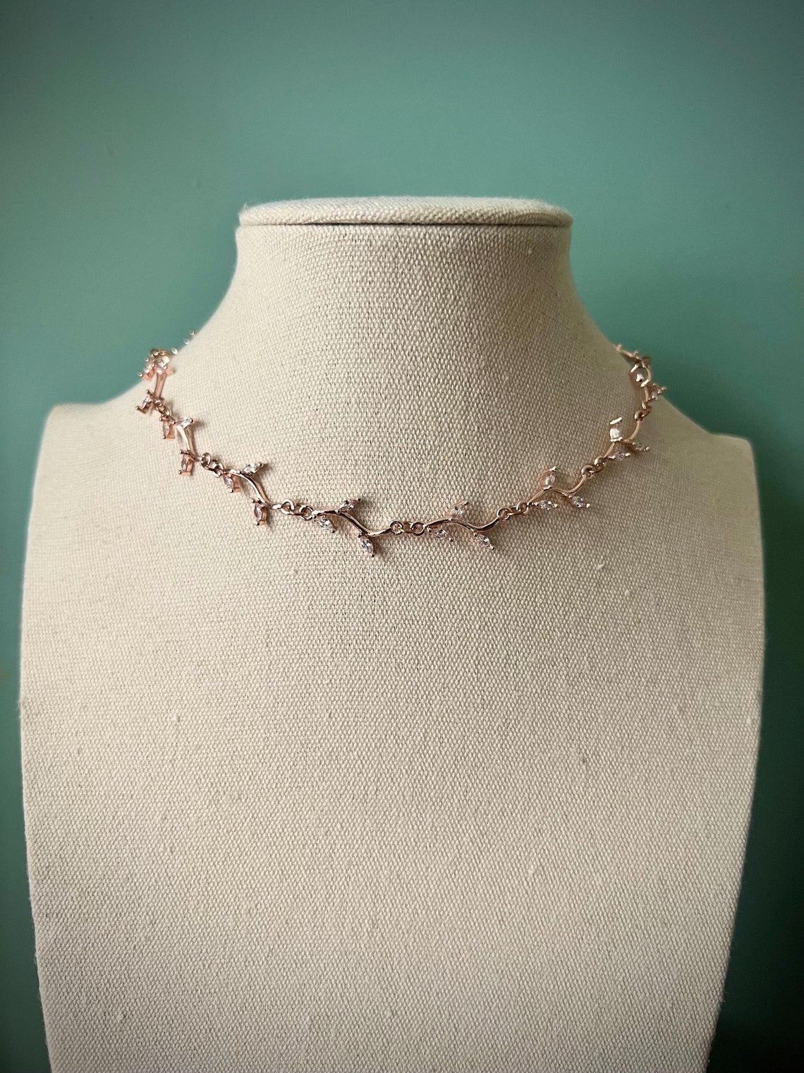 Delicate white leafy vine rose gold choker necklace