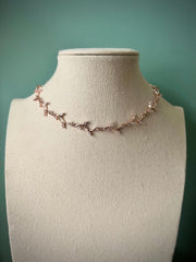 Delicate white leafy vine rose gold choker necklace