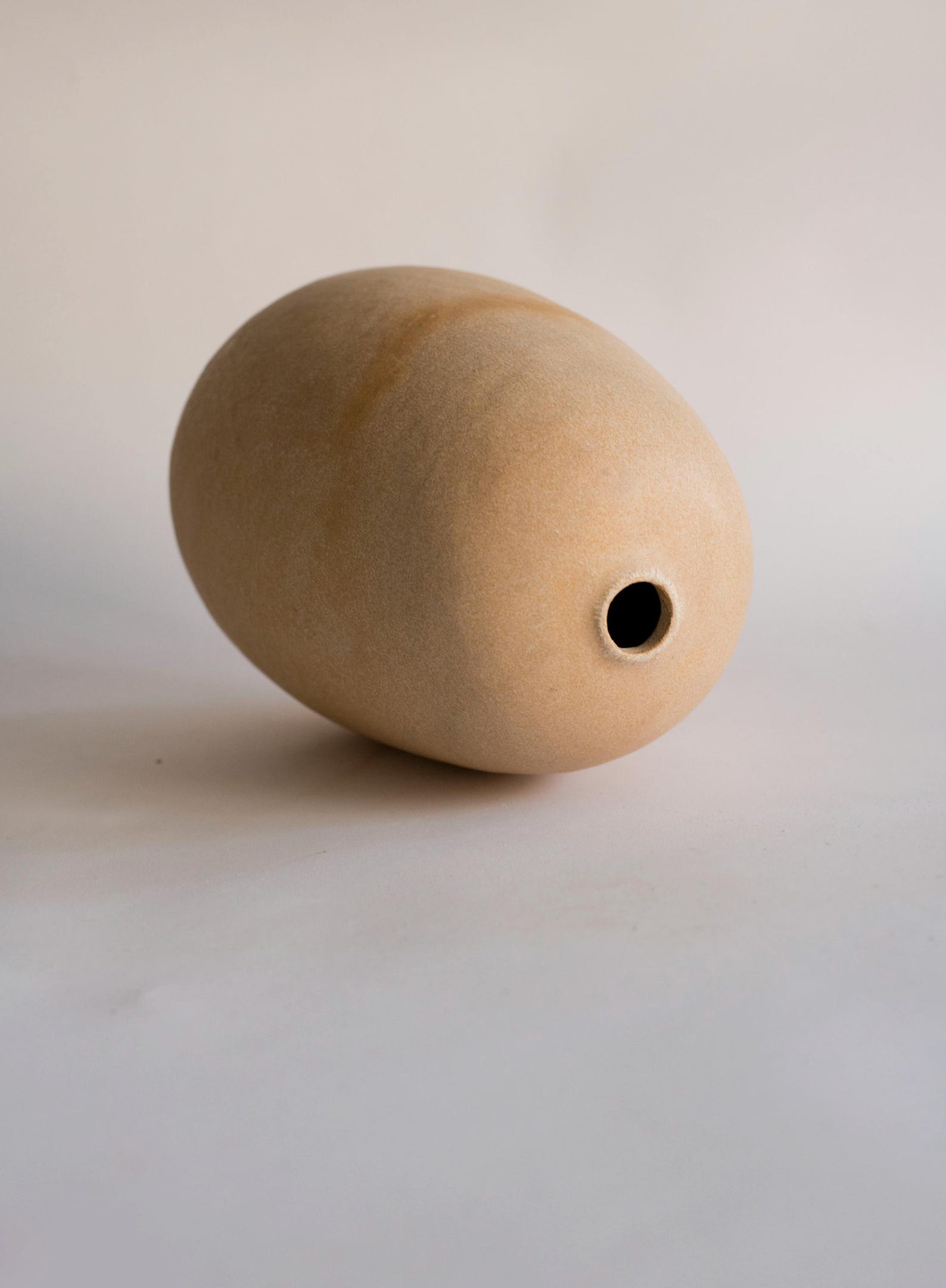 Handmade beige oval vase