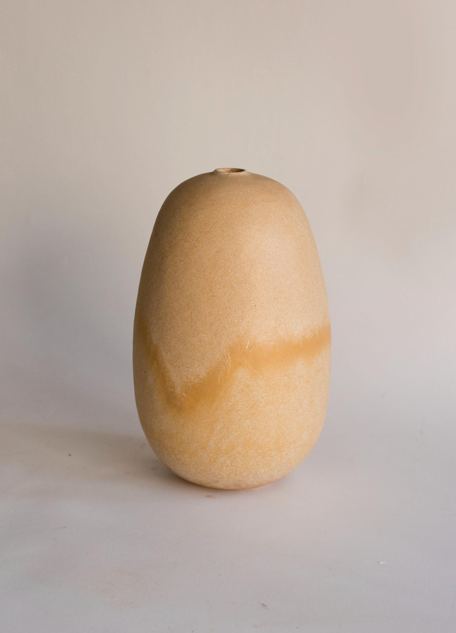 Handmade beige oval vase
