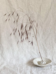Japanese flower arranging Ikebana in cream off white Glaze
