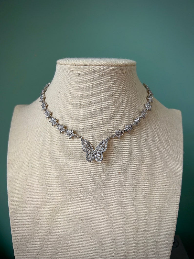 Sparkly gold butterfly white flower choker necklace
