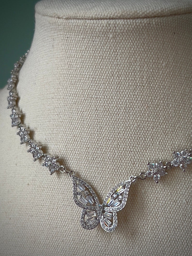 Sparkly gold butterfly white flower choker necklace