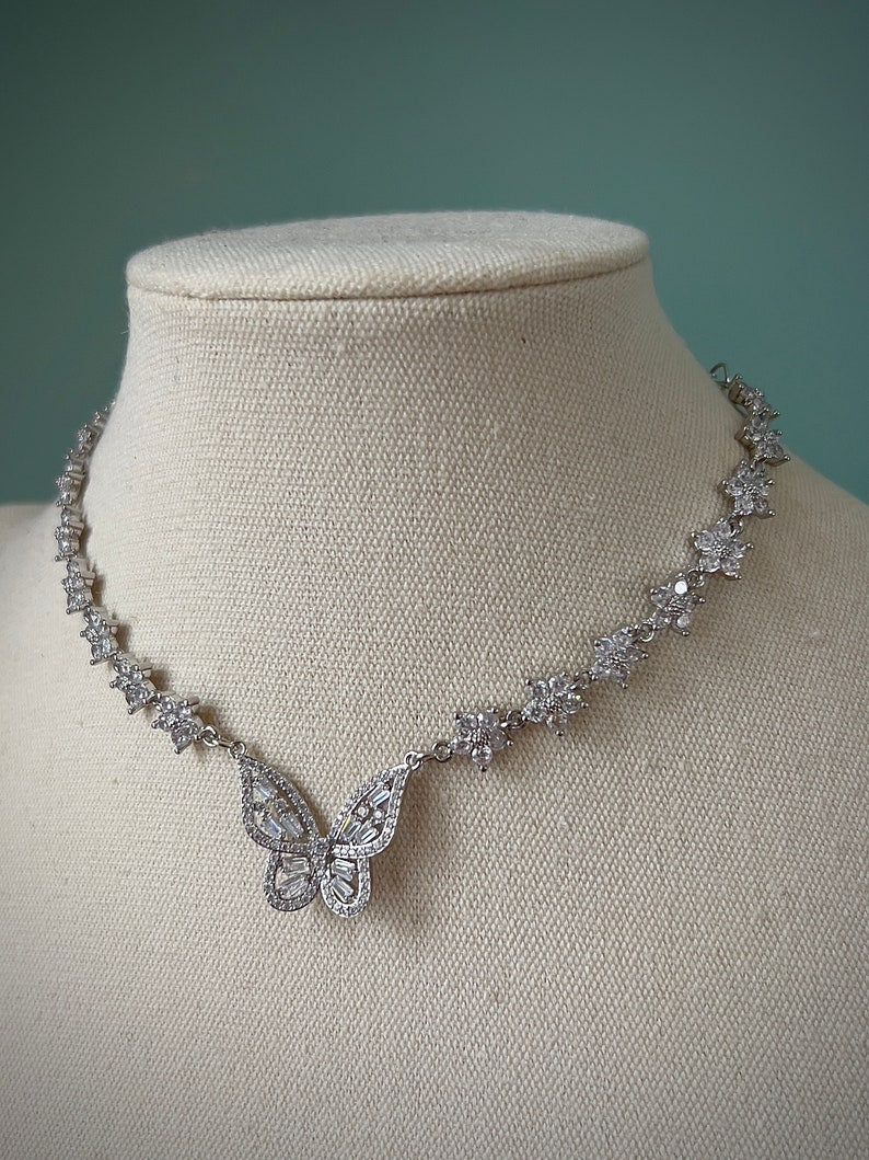 Sparkly gold butterfly white flower choker necklace