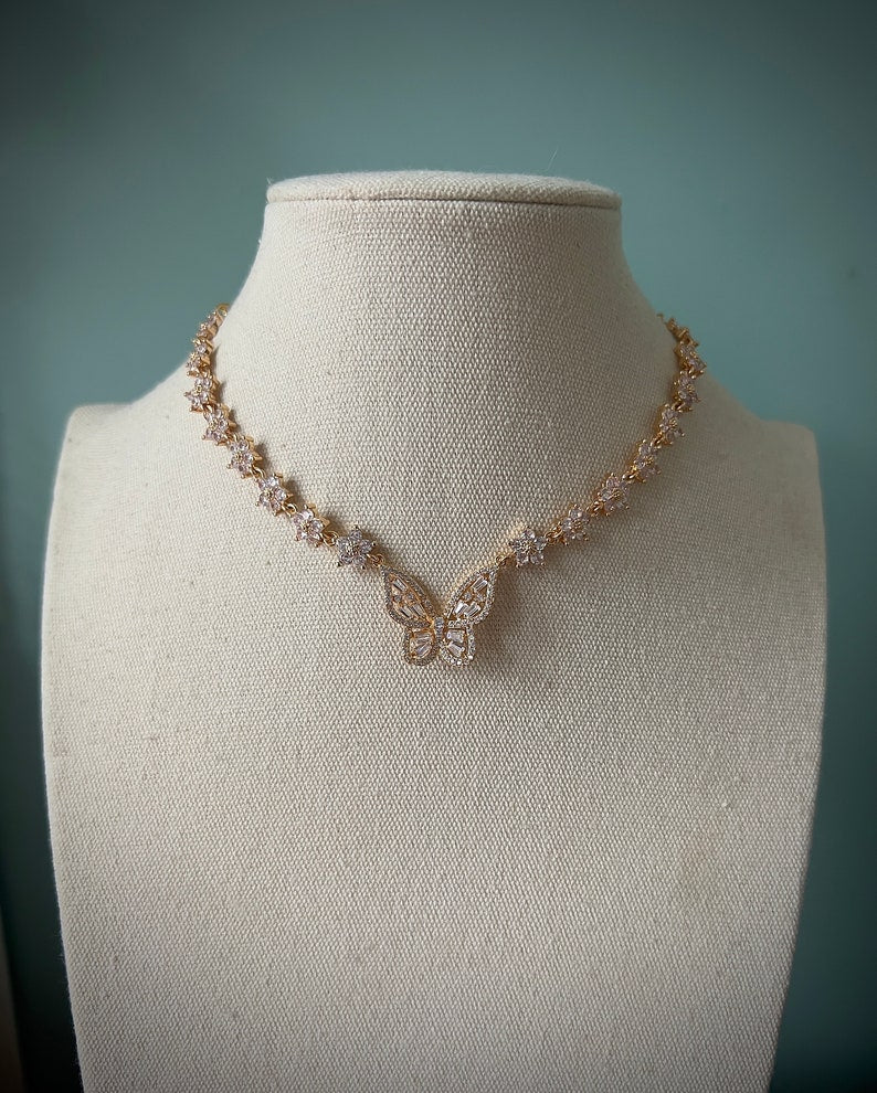 Sparkly gold butterfly white flower choker necklace