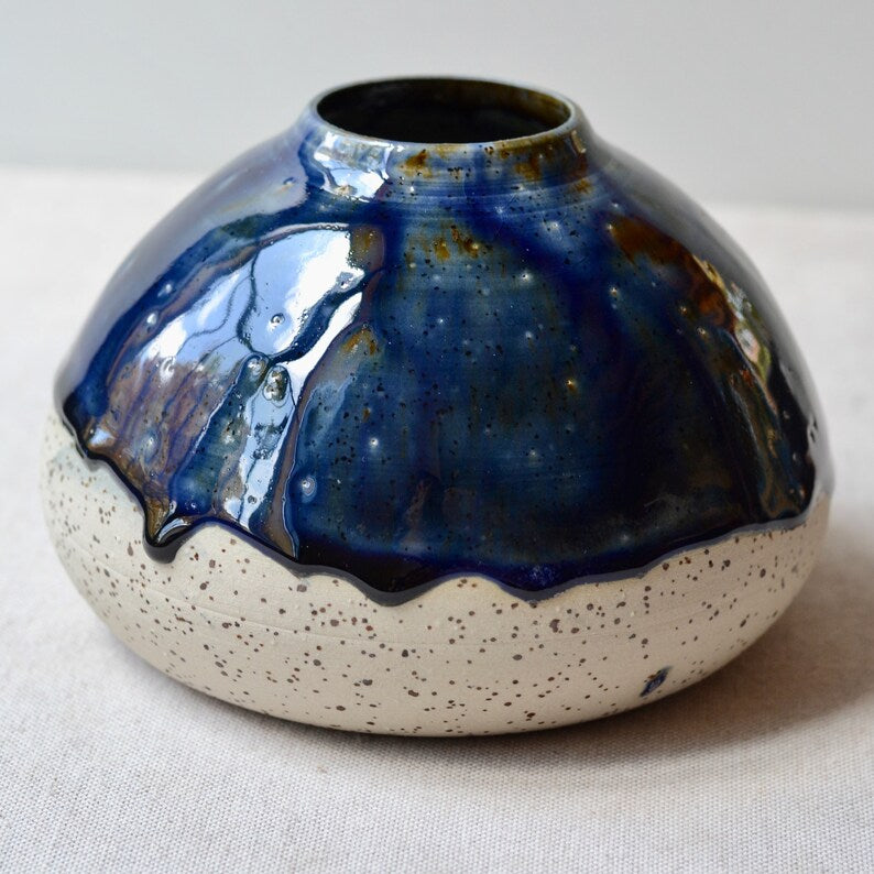 Handmade speckled clay vase with blue glaze