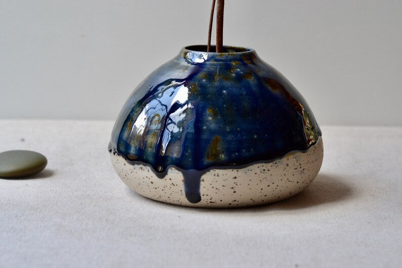 Handmade speckled clay vase with blue glaze