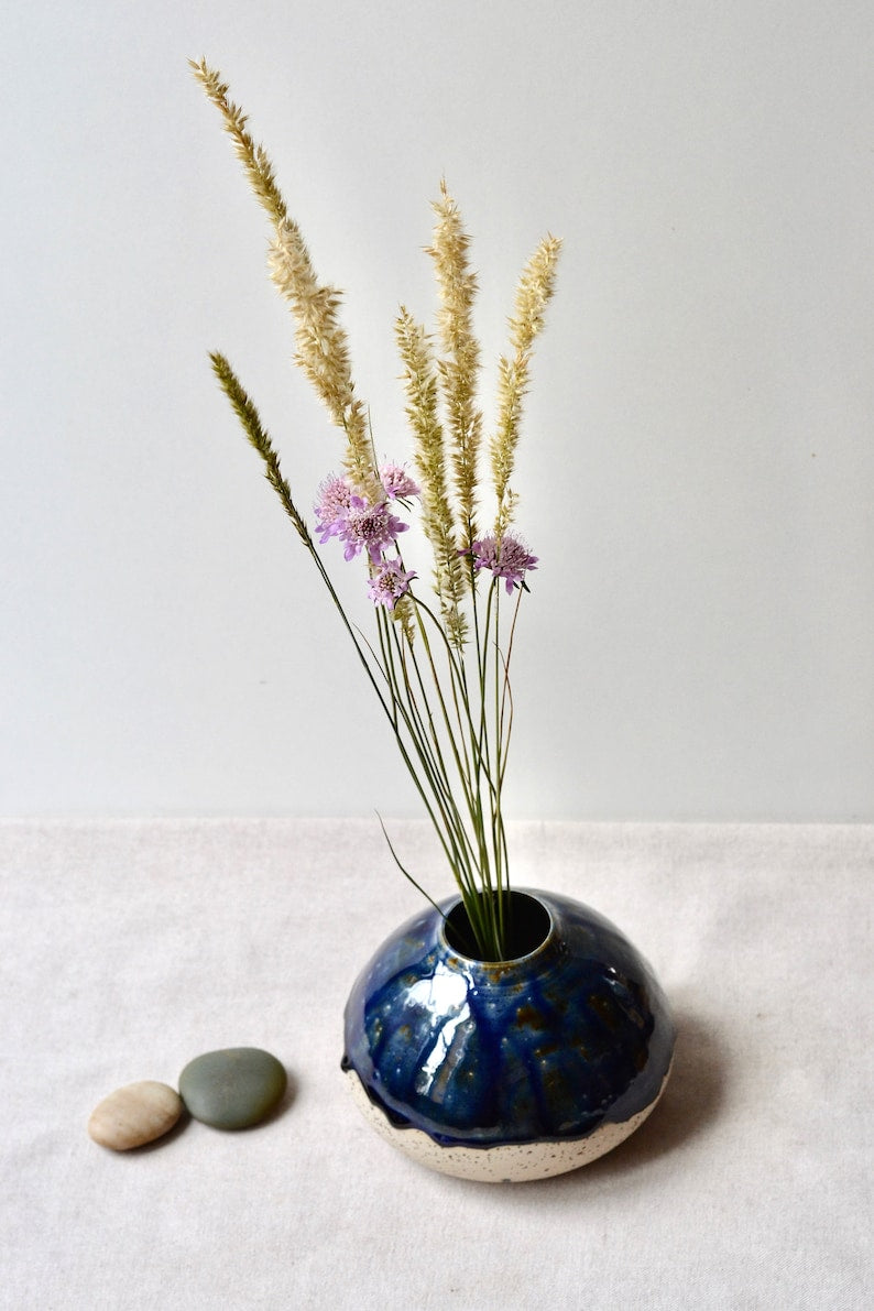 Handmade speckled clay vase with blue glaze