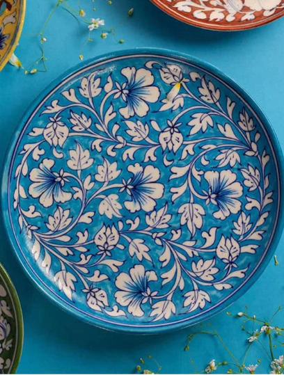 Decorative plate with floral pattern on a blue background