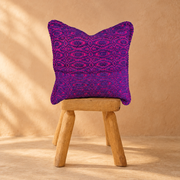 Pacha Cushion with a warm artisan-style background