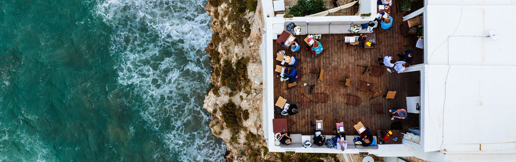 Aerial view of a rooftop bar with ocean view